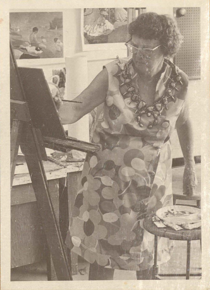 An older photo of a woman frowning studiously as she paints on an easel