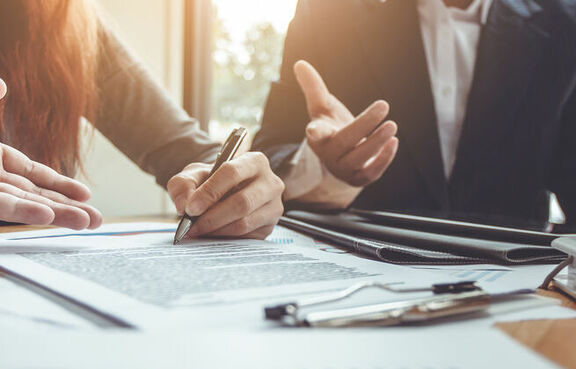 Business Professionals signing contract