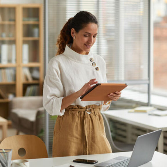 Businesswoman working on a tablet in an office