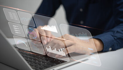 Man at a laptop looking at an analytical dashboard