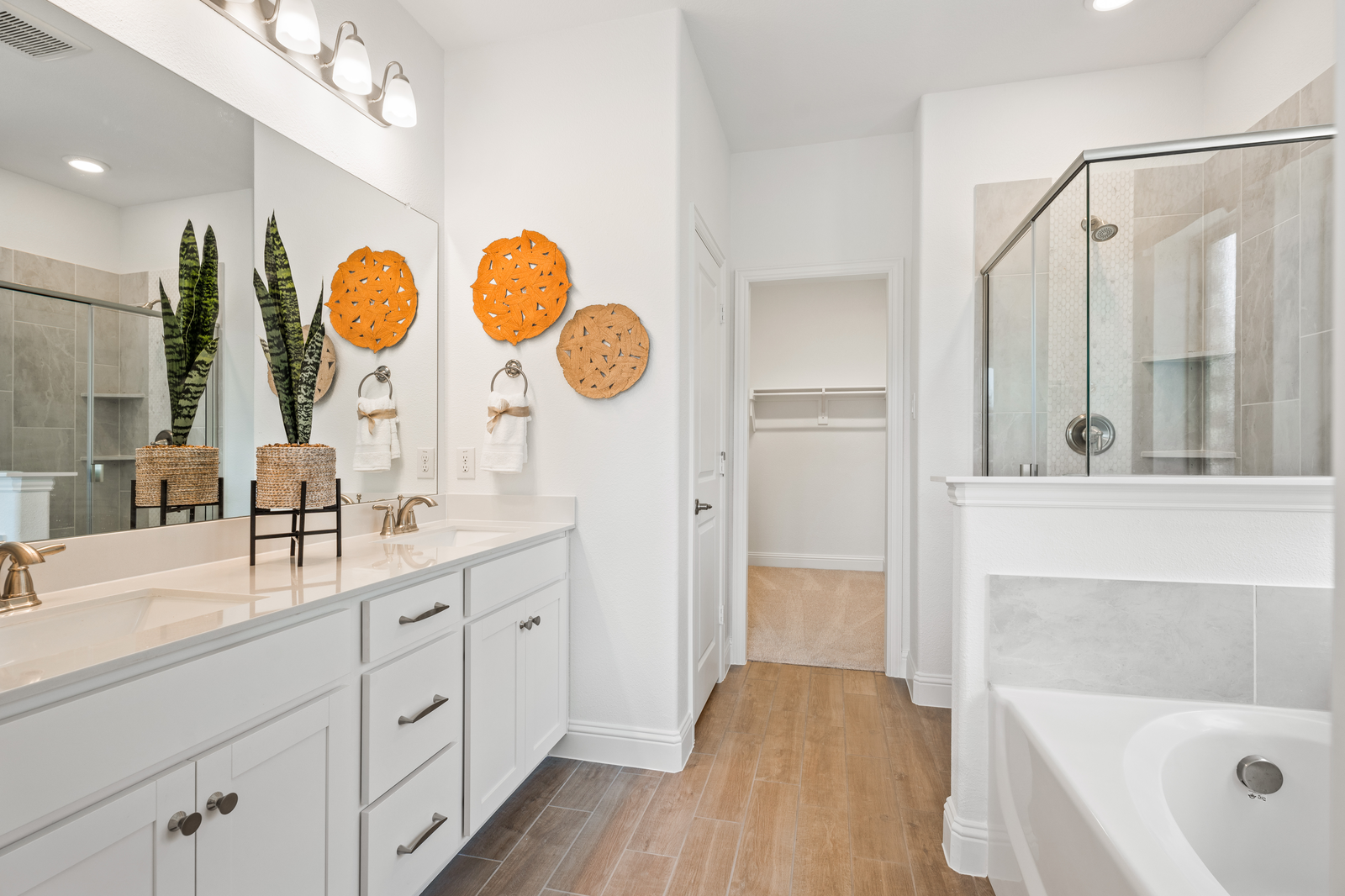 primary bathroom with white cabinets