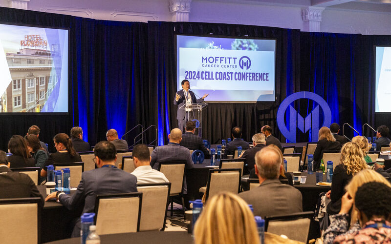 Dr. Patrick Hwu on stage welcoming attendees to the Inaugural Cell Coast Conference