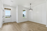 dining room with wood flooring and large windows