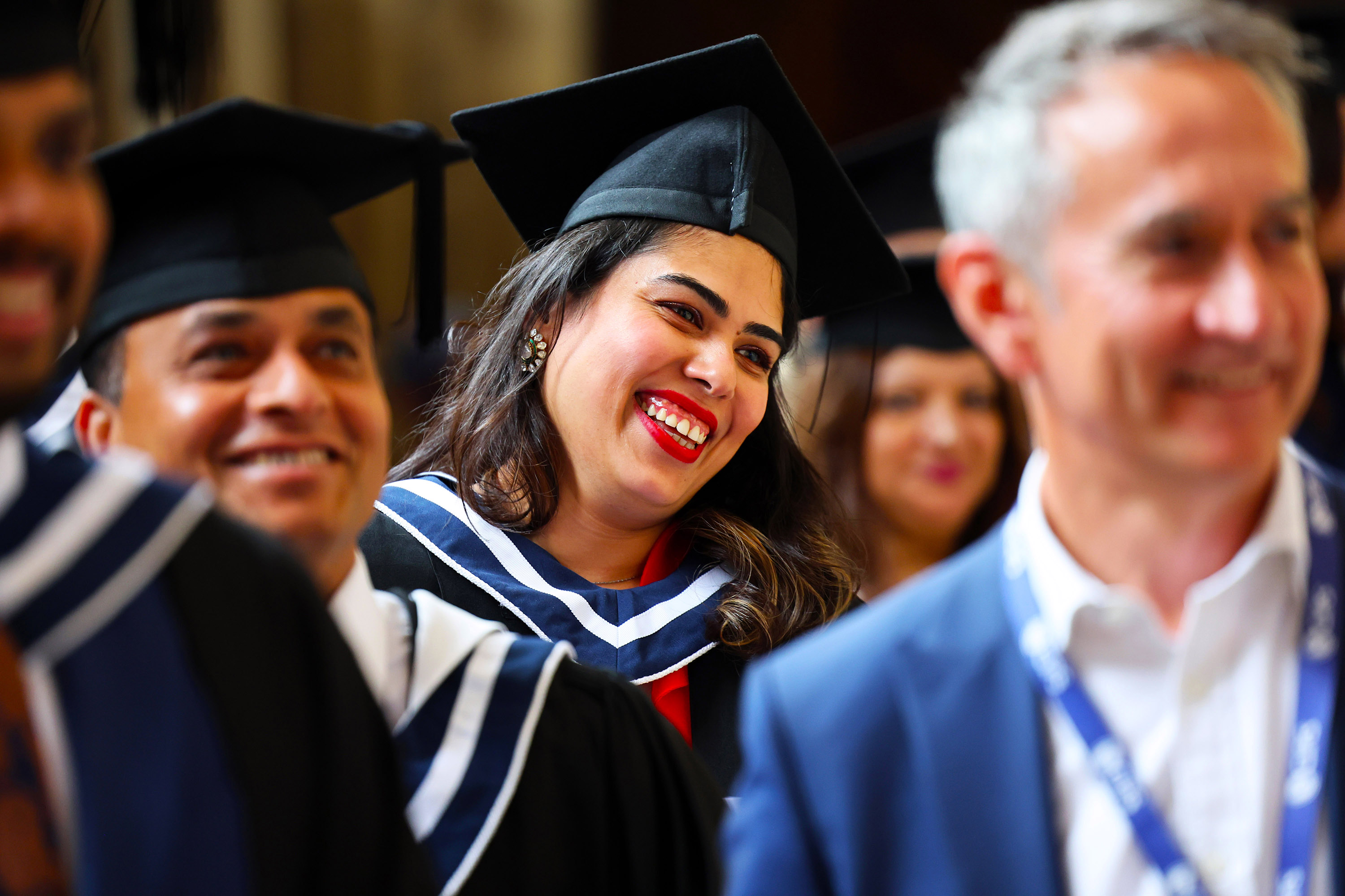 Close-up of a smiling female graduate wearing her cap and gown