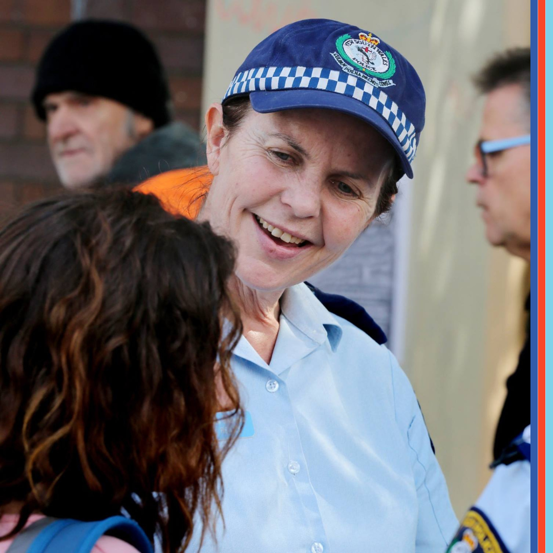 QLD Police Force member speaking with a local resident.