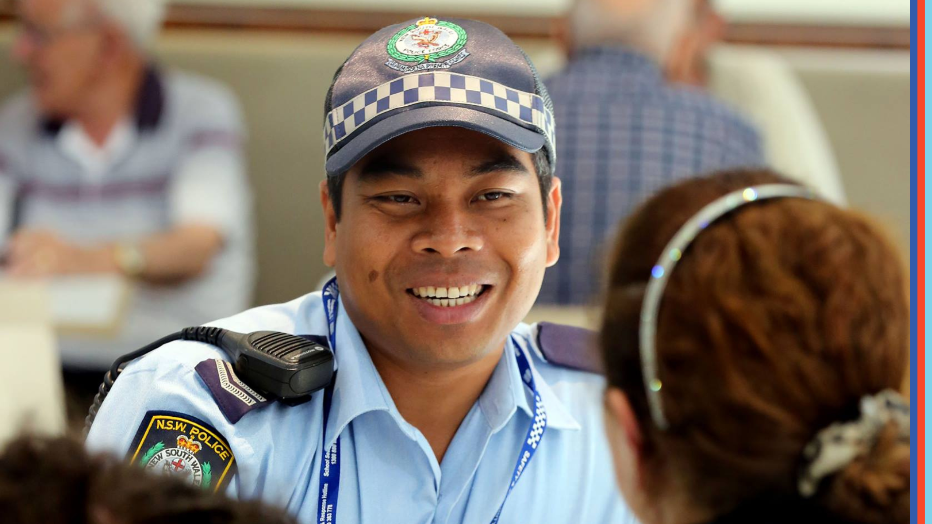 QLD Police Force member speaking with a local resident.