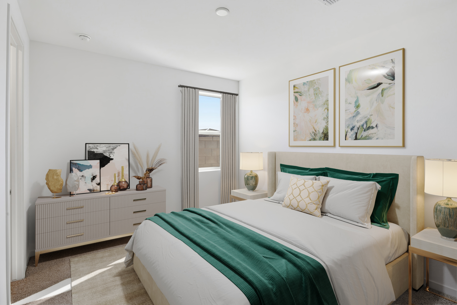 spacious bedroom with beige rug, large white bed with royal green duvet, and white nightstands
