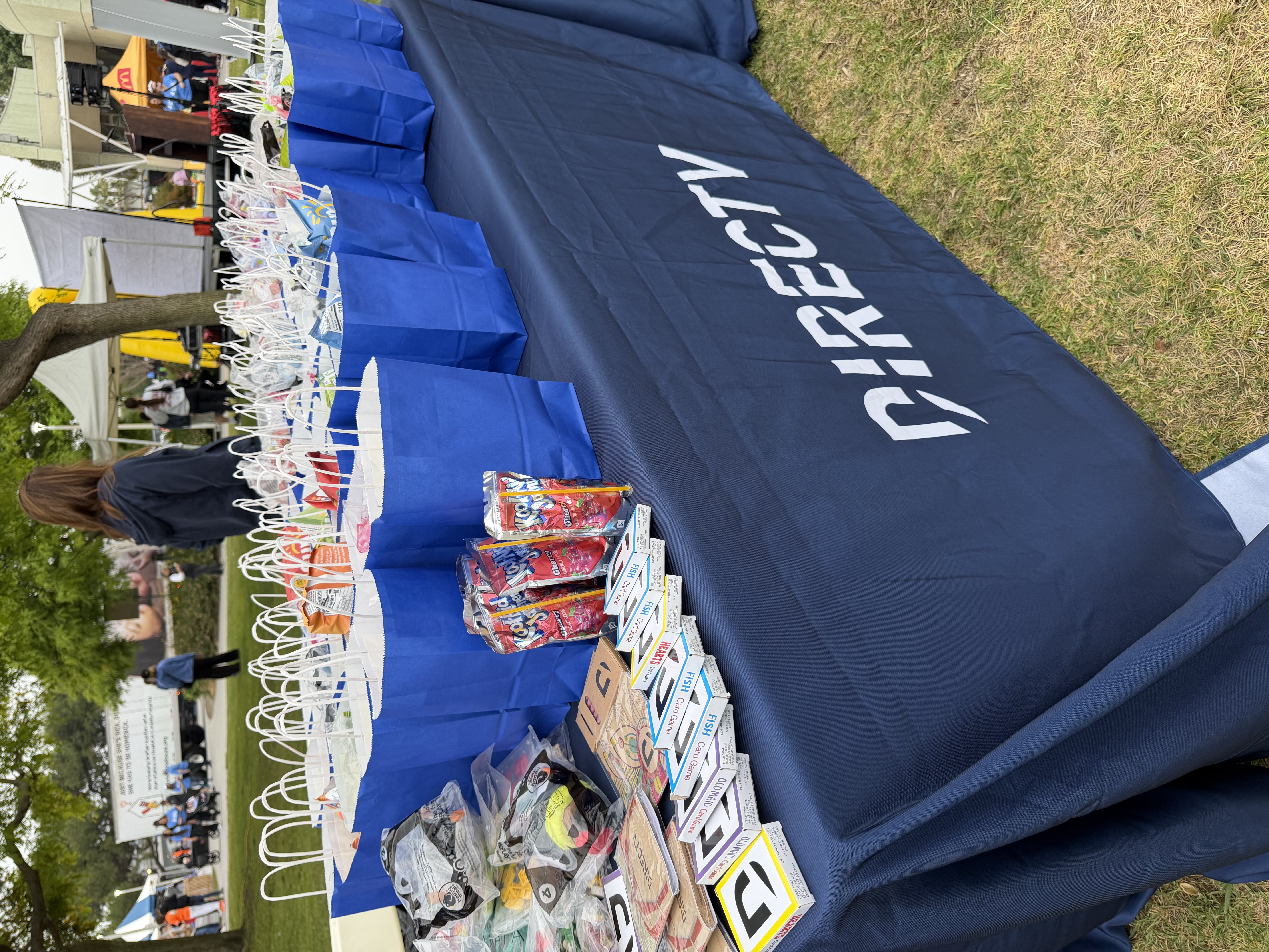 DIRECTV Table w Branded Merch at RMHC LB WFK.jpg