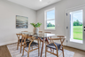 dining room with hard surface flooring and windows