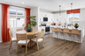 dining area with neutral floors near kitchen