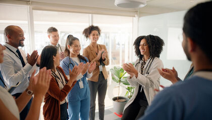 Doctor coach and applause with team in meeting