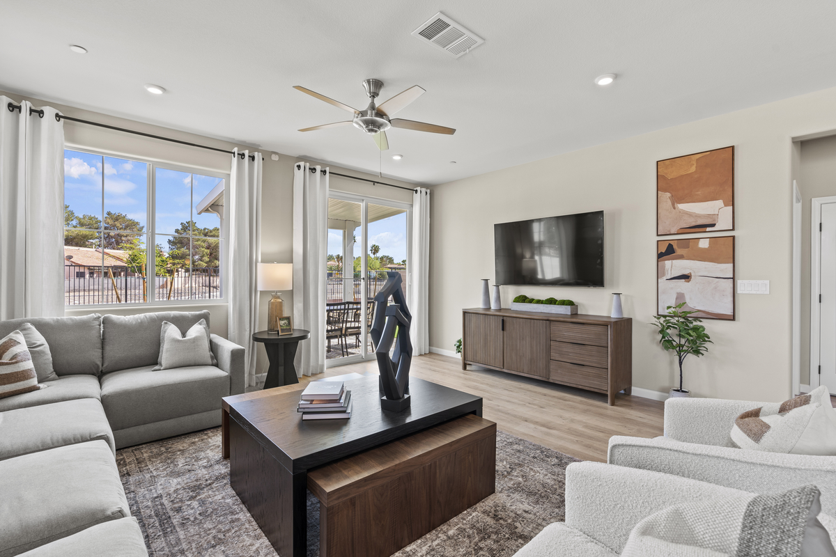 light filled living room with sectional couch