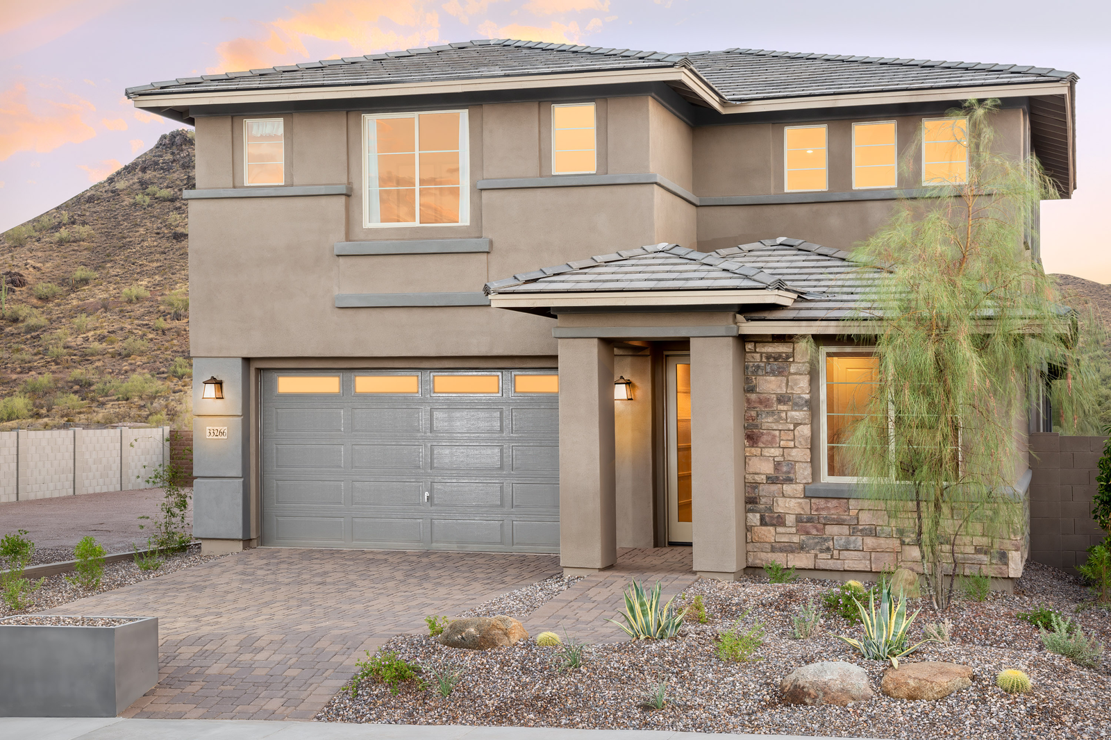 two-story home with desert landscaping