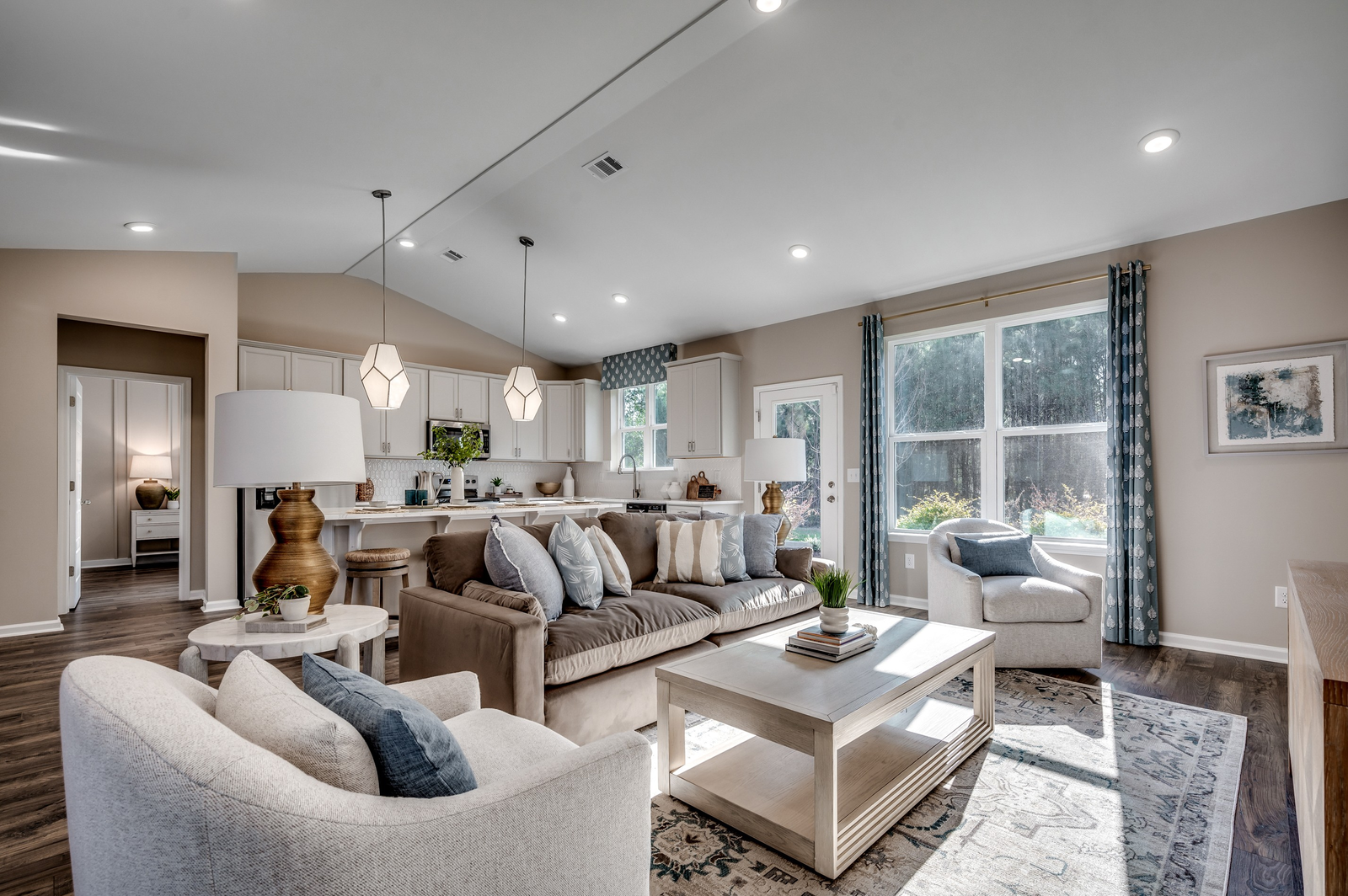 tan walls and large windows with natural lighting