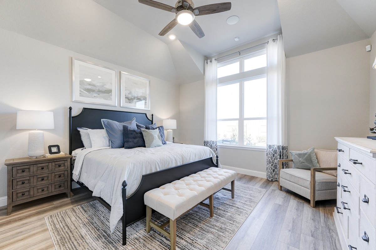 bedroom with ceiling fan and wood flooring 