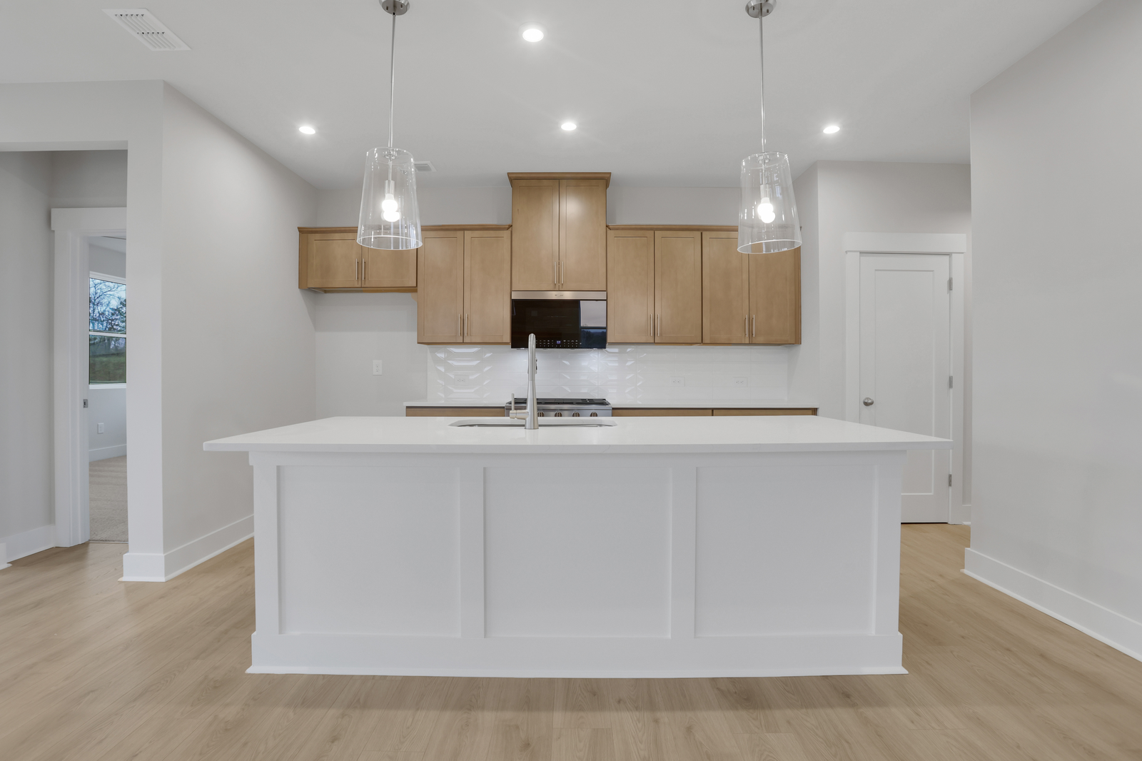 kitchen with large island and wood-finish cabinets