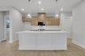 kitchen with large island and wood-finish cabinets