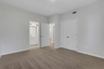 bedroom with windows and carpet