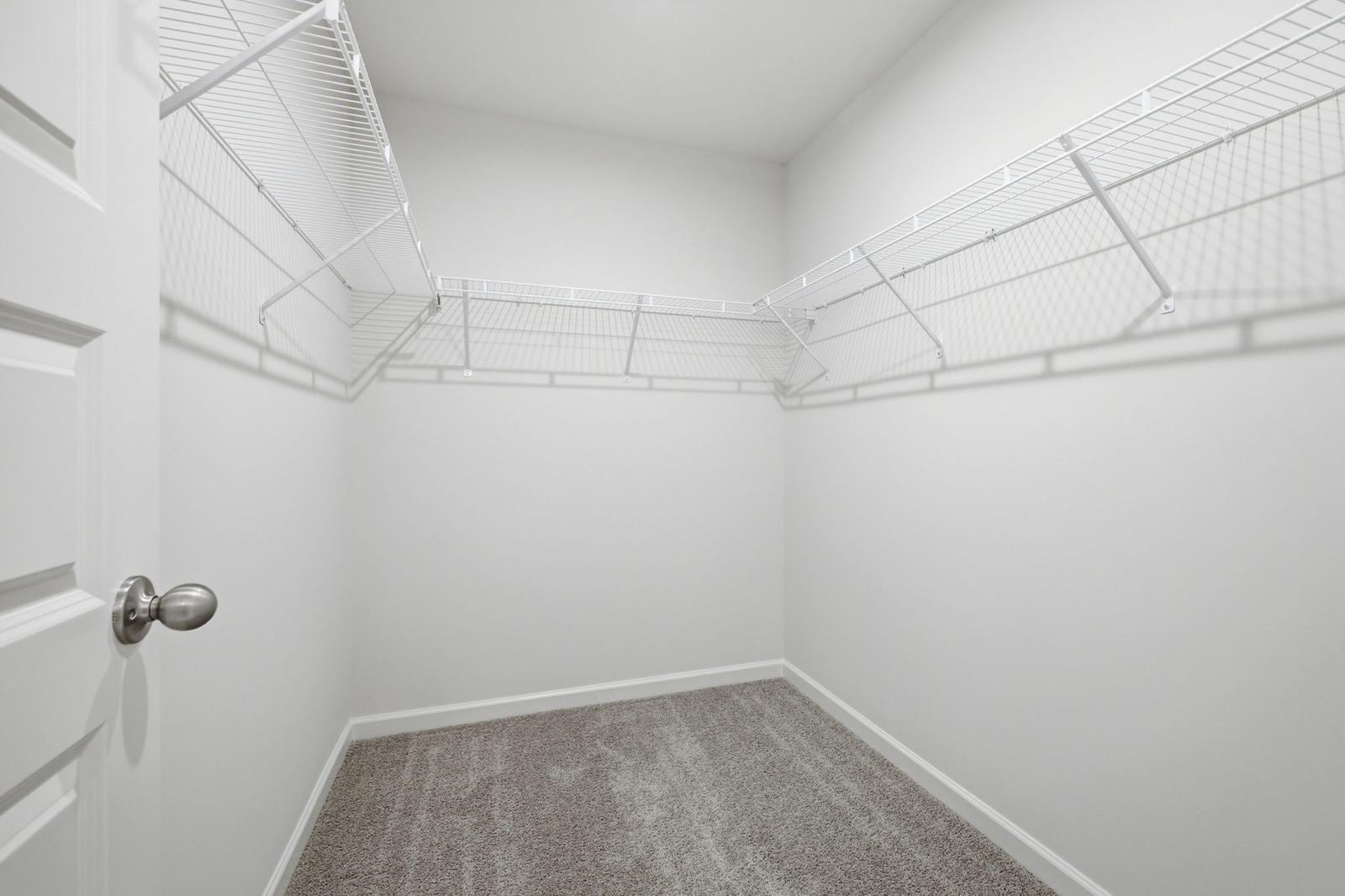 primary closet with built in shelf