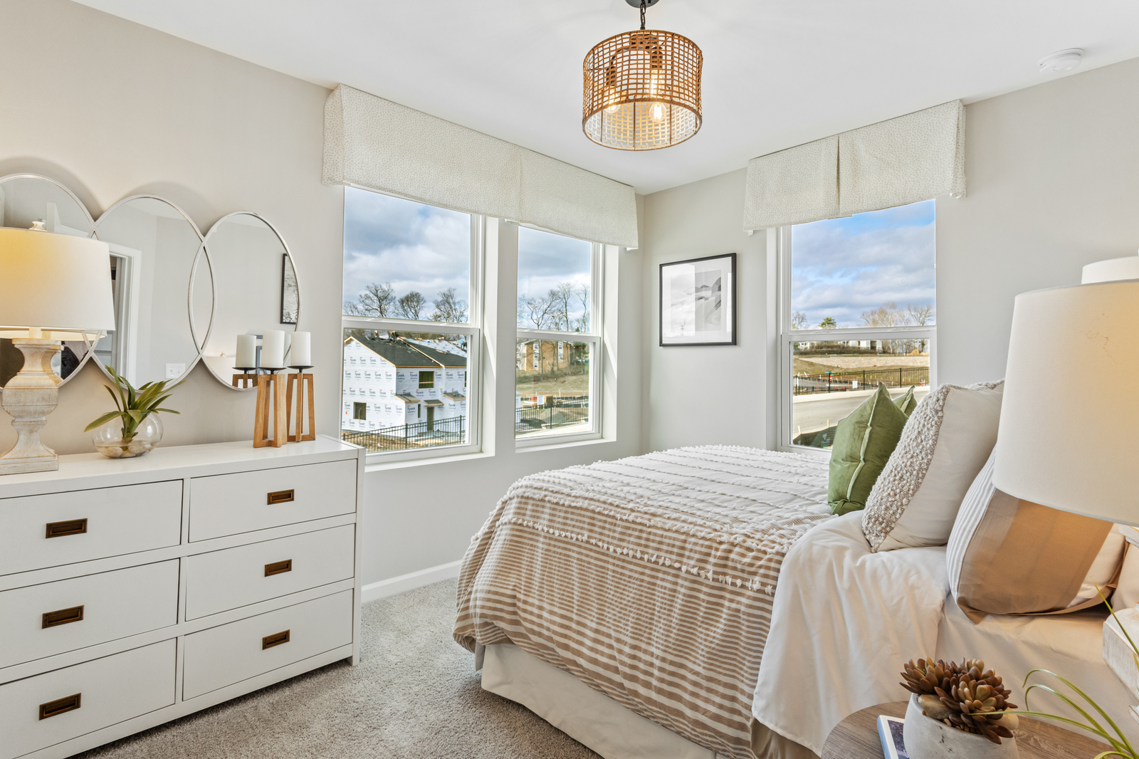 bedroom with large windows and carpet