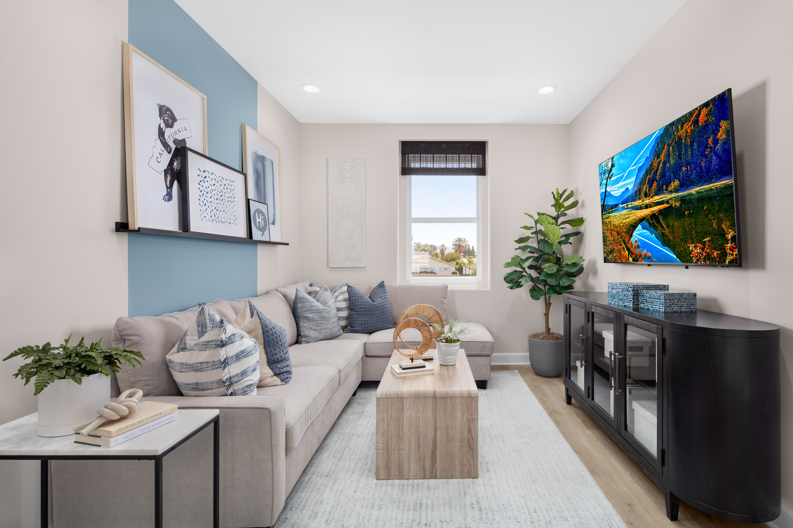 loft with neutral floors and large window