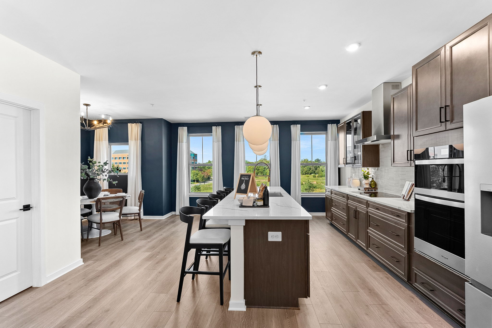 kitchen with quartz countertops and brown cabinets