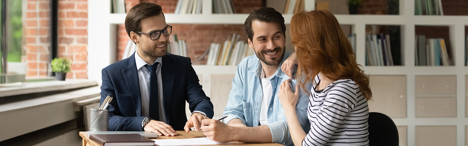 A couple discussing their financial options with an advisor