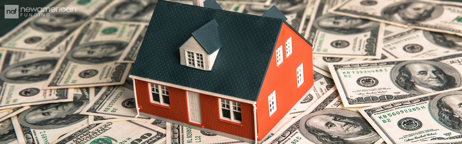 Model of house on money