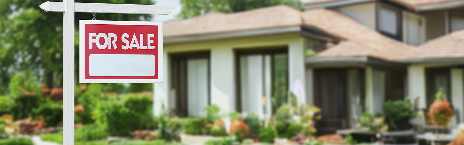 A home with a for sale sign