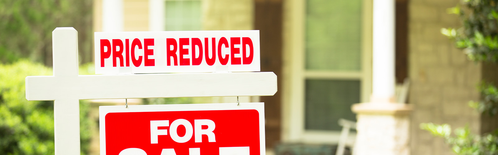 A price reduced home for sale sign