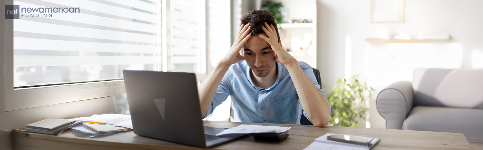 A person sitting in front of a computer