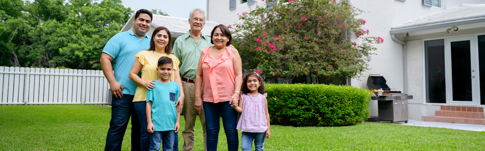 A family in front of their home
