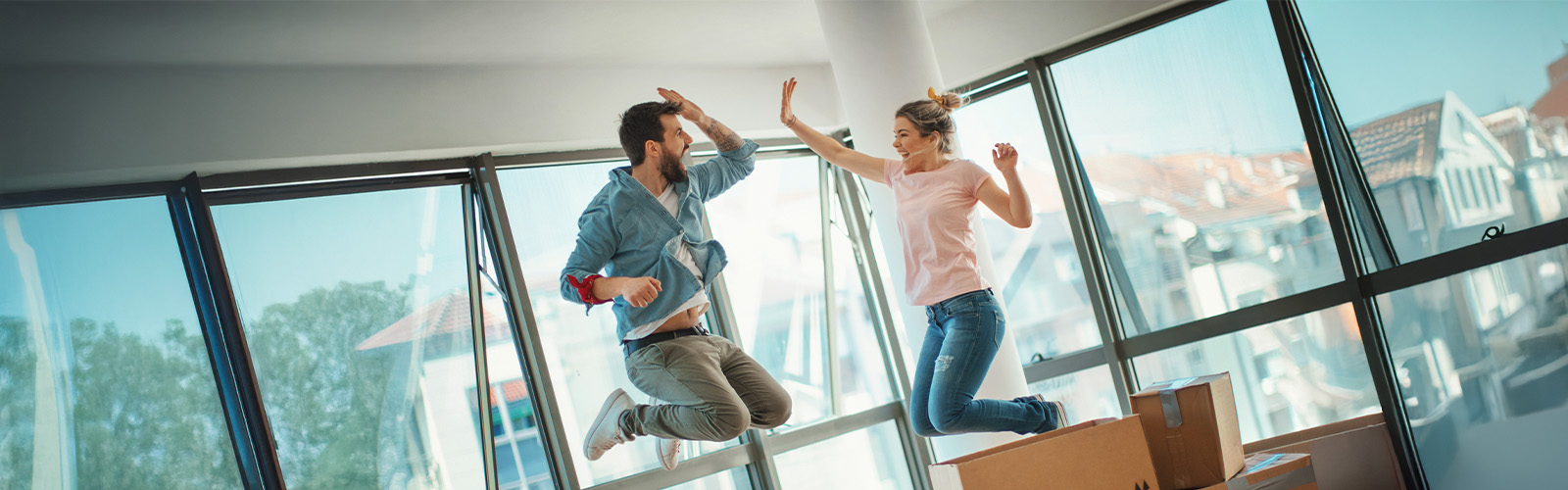 Young couple celebrating their new home purchase