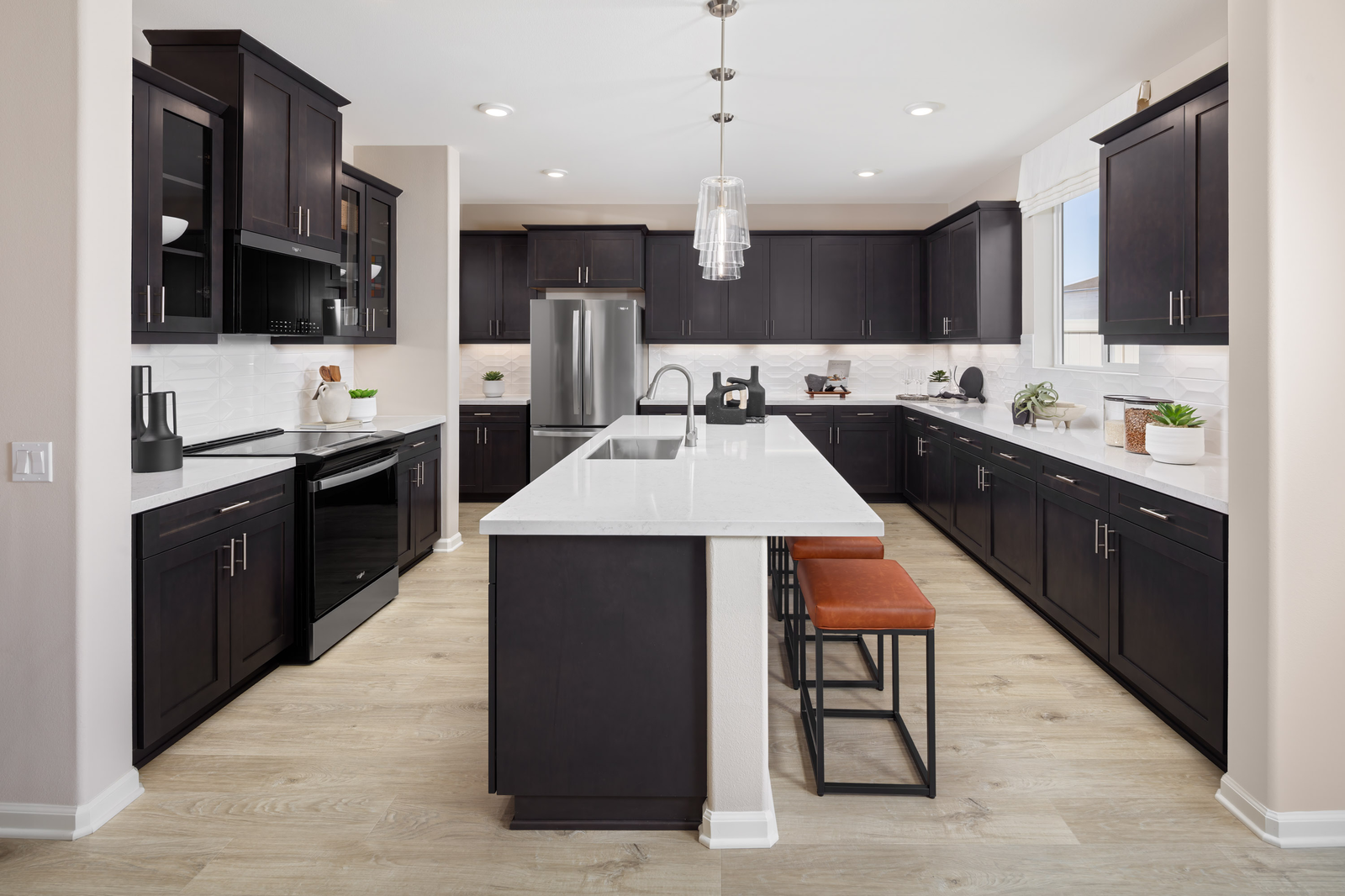 kitchen with white countertops and dark cabinets