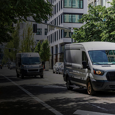 White truck with onboard Fathom e-power system in city