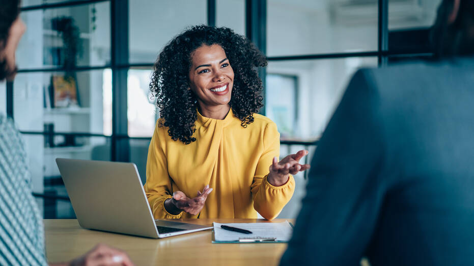 Smiling Human Resources professional in a meeting