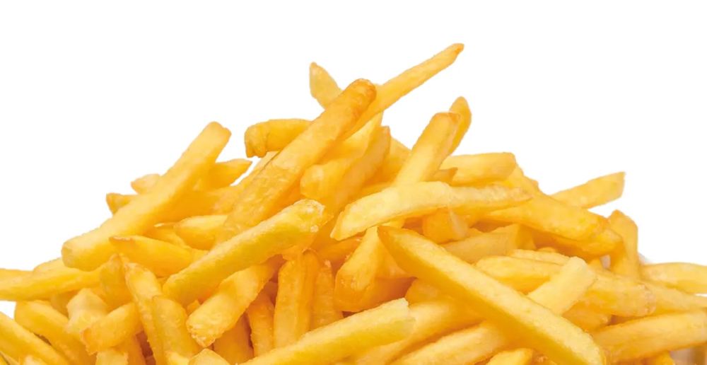 A pile of bright yellow french fries on a white background