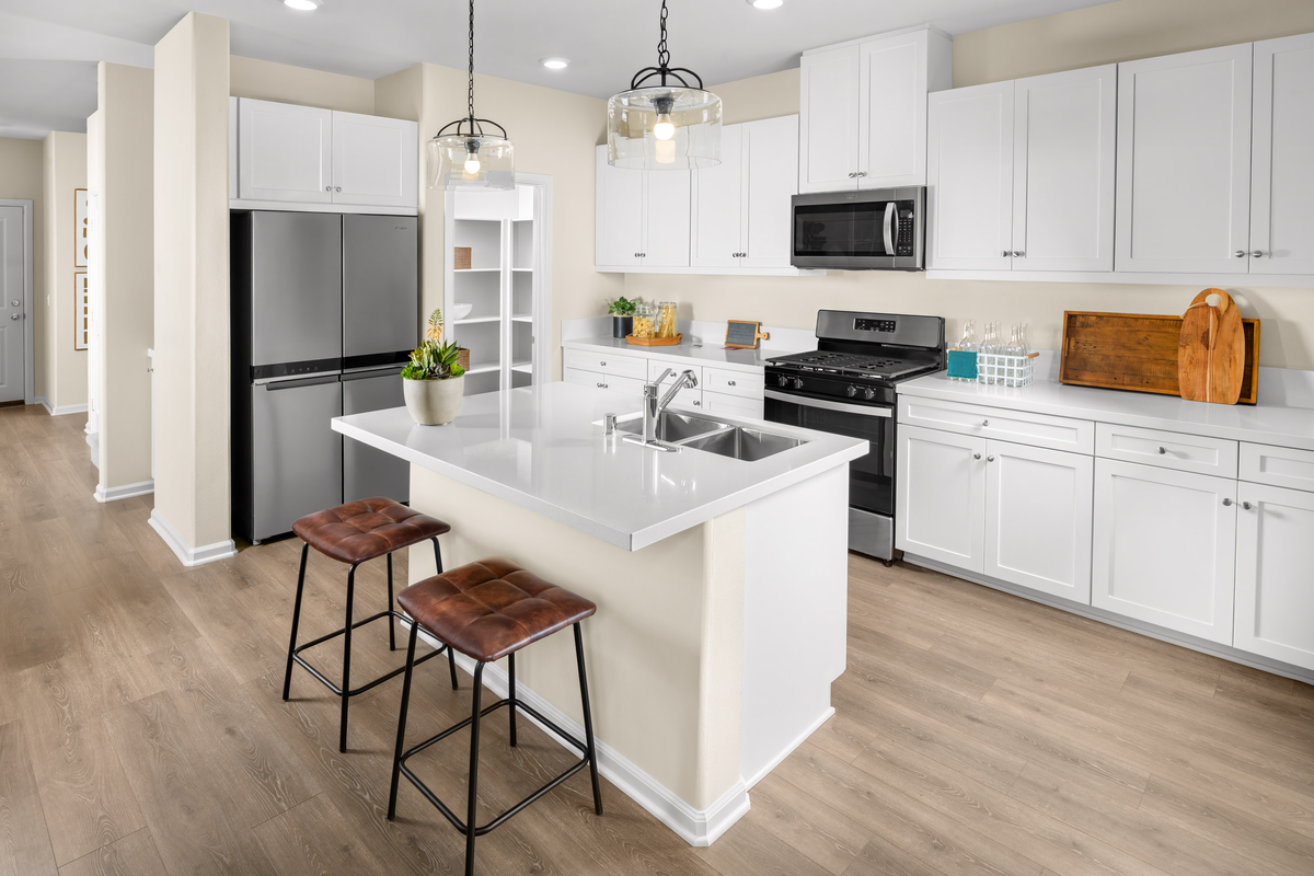 kitchen with white cabinets and white countertops