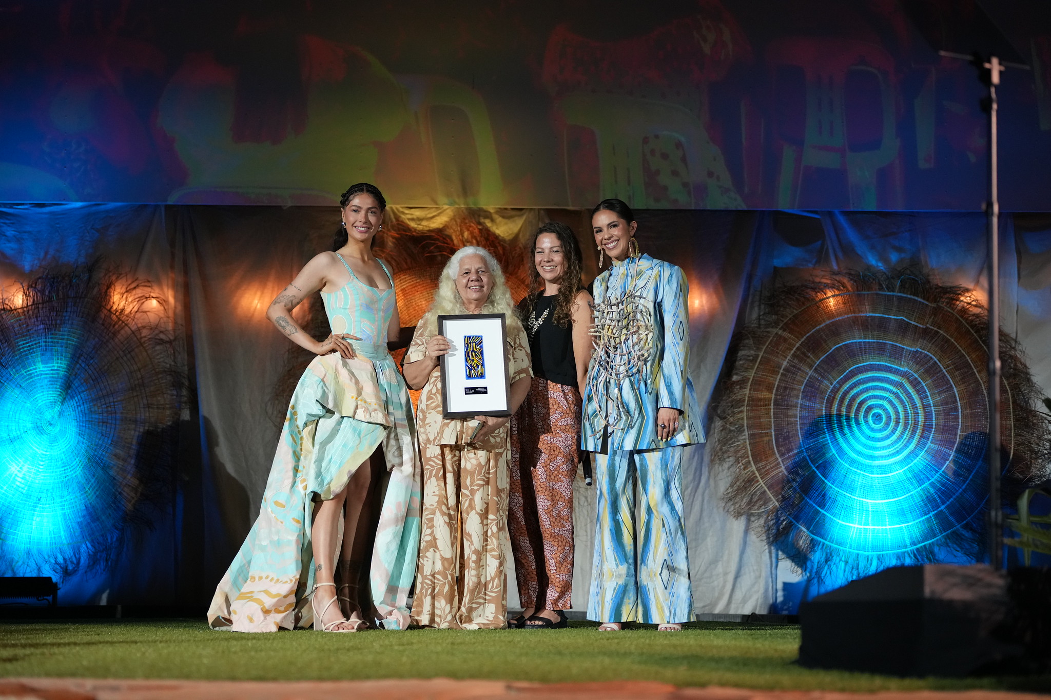 Lauren Jarrett accepting the award on behalf of Melissa Greenwood of Miimi & Jiinda, Business Achievement Award: Supported by QIC, National Indigenous Fashion Awards, 2025, Photo by Dylan Buckee