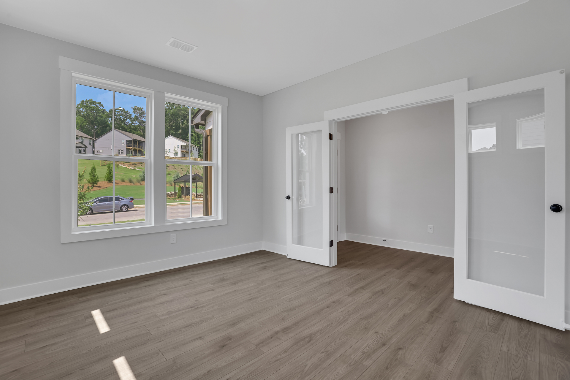 study with french doors and hard surface flooring