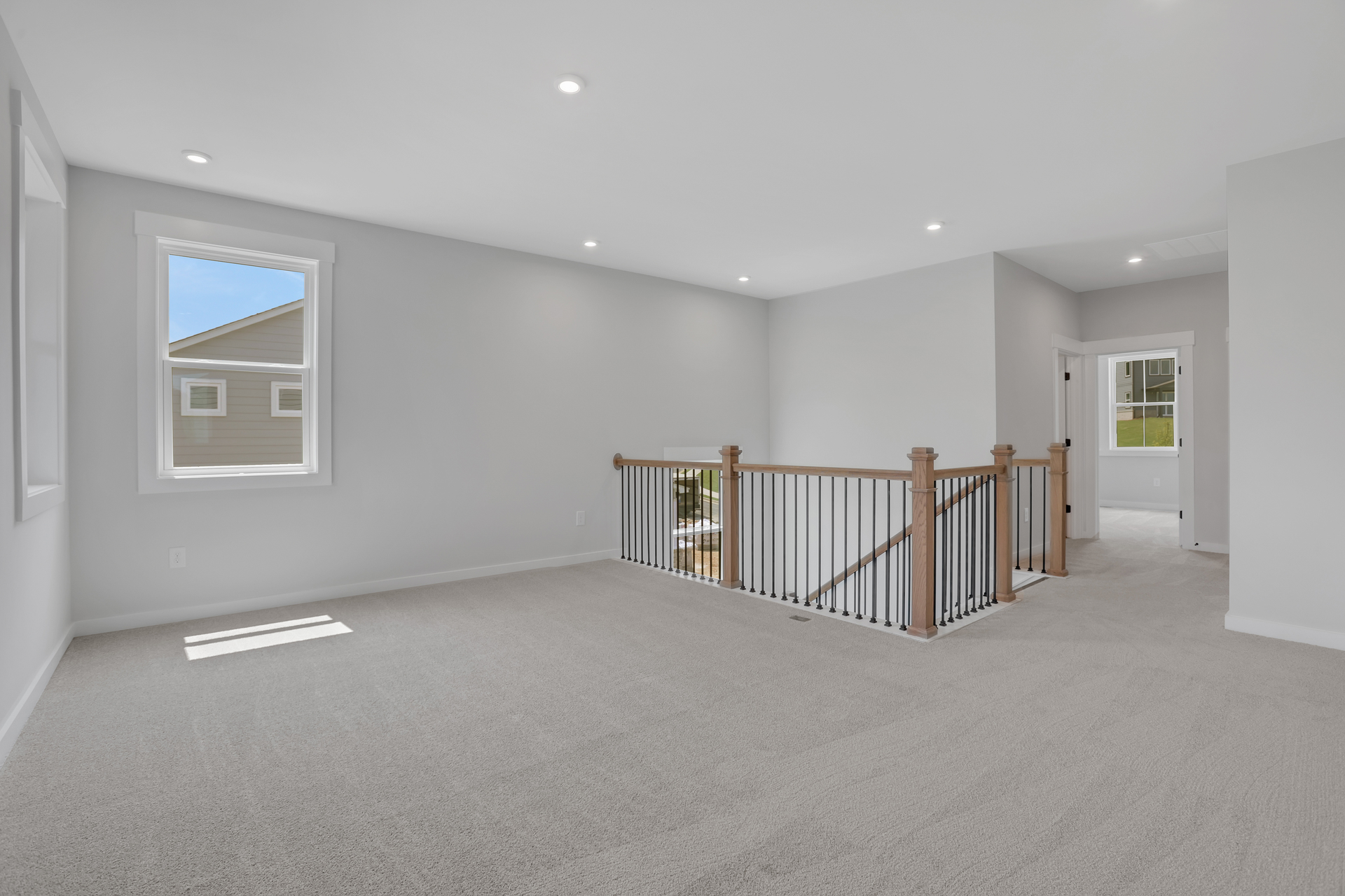 loft with carpet and windows