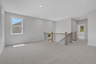 loft with carpet and windows