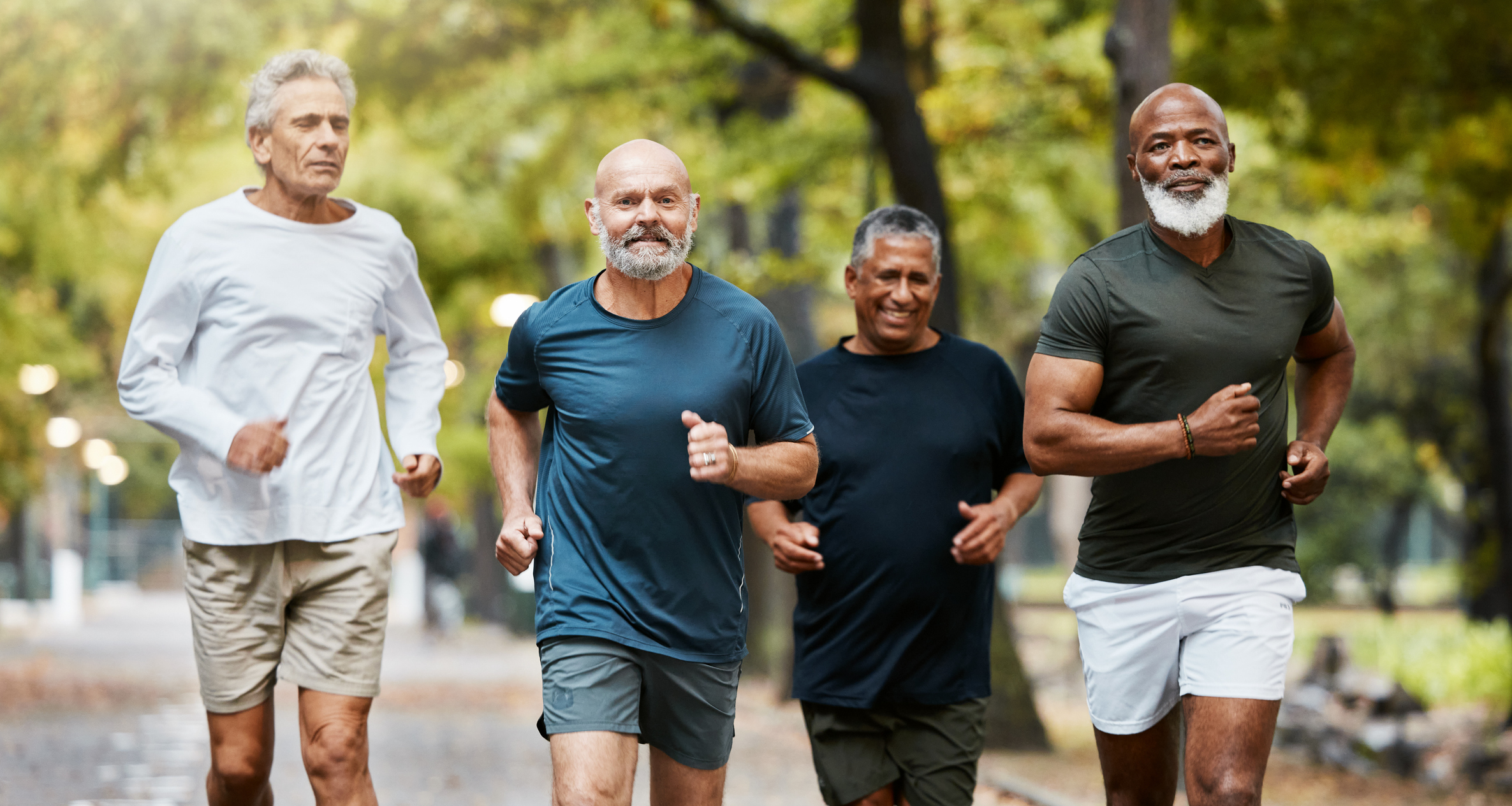 a group of men running int he park