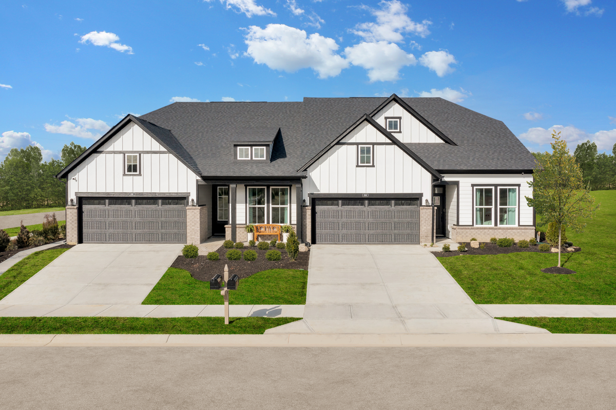 duets with farmhouse exterior with 2-car garages