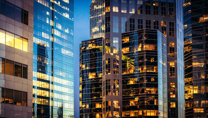 Modern glass offices at dusk