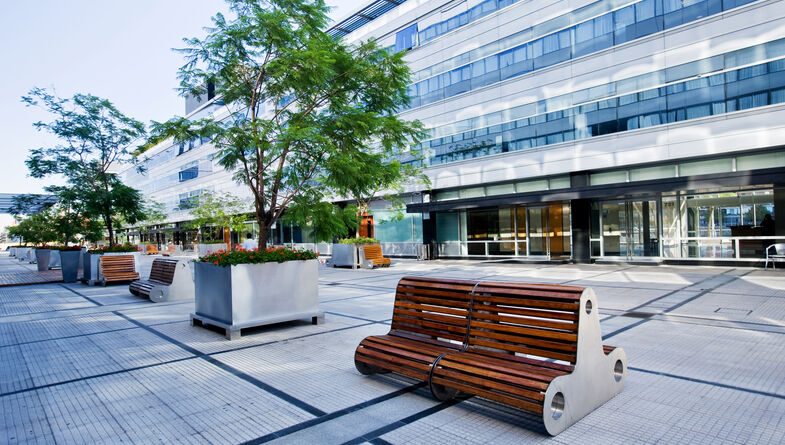 Outdoor modern common area among commercial buildings
