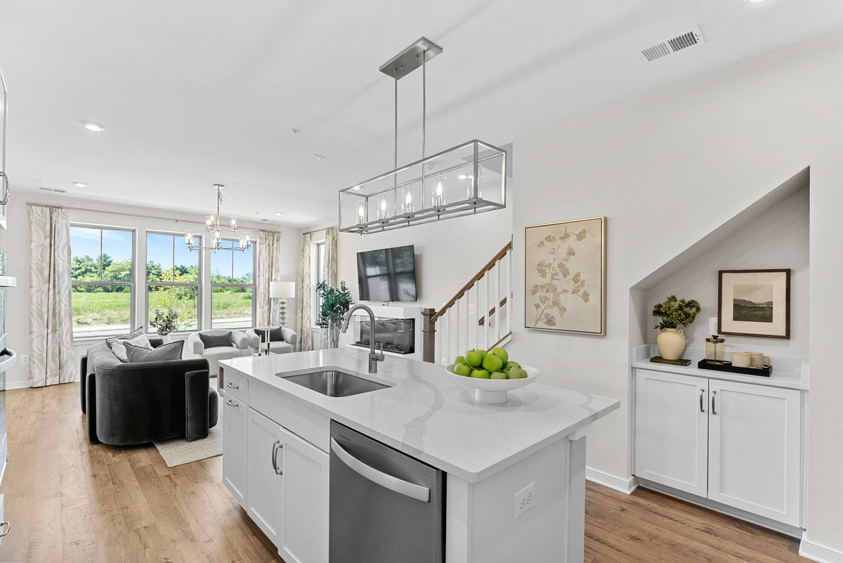 kitchen with an island with a sink