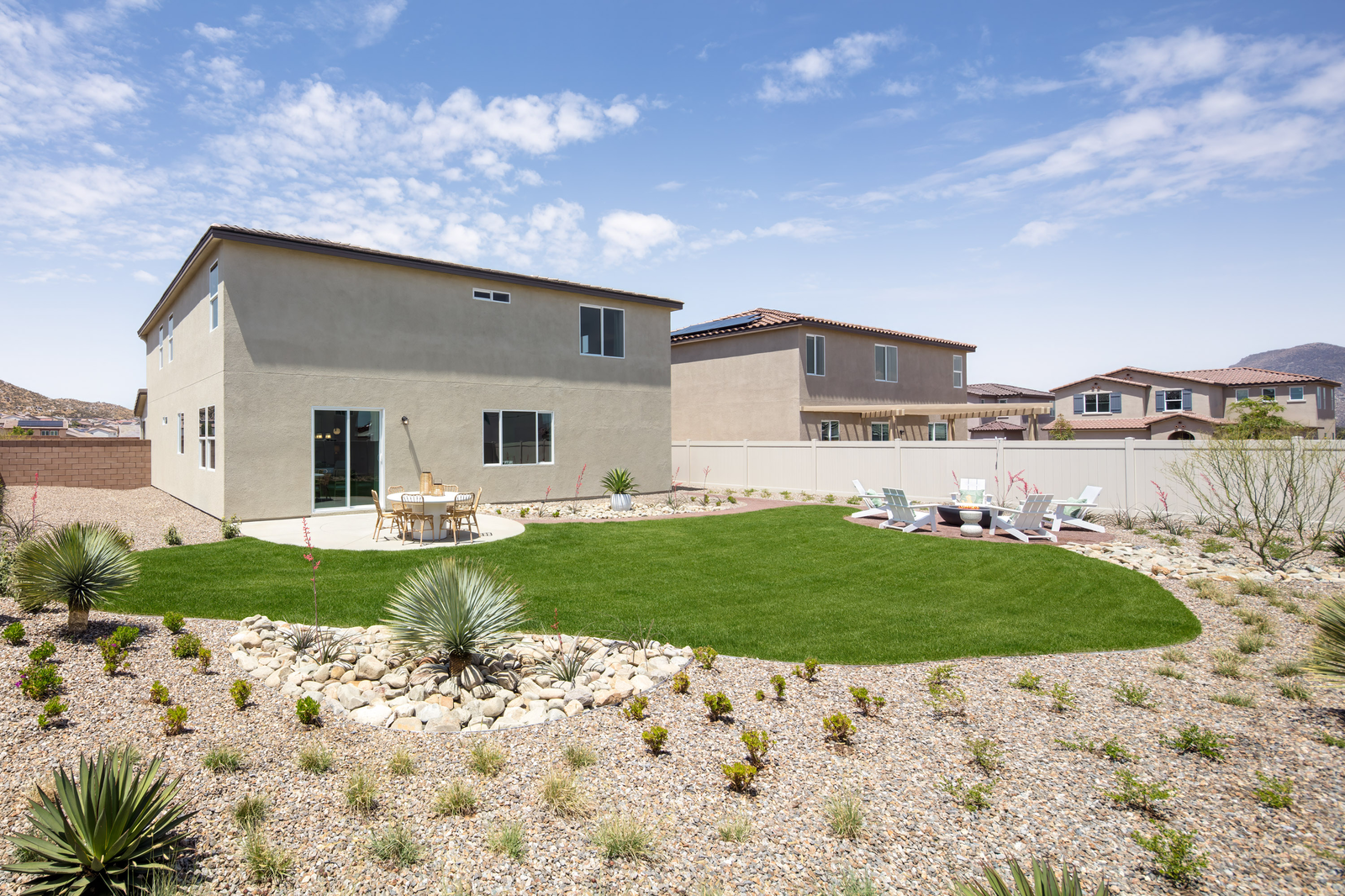 backyard with desert landscaping and seating area