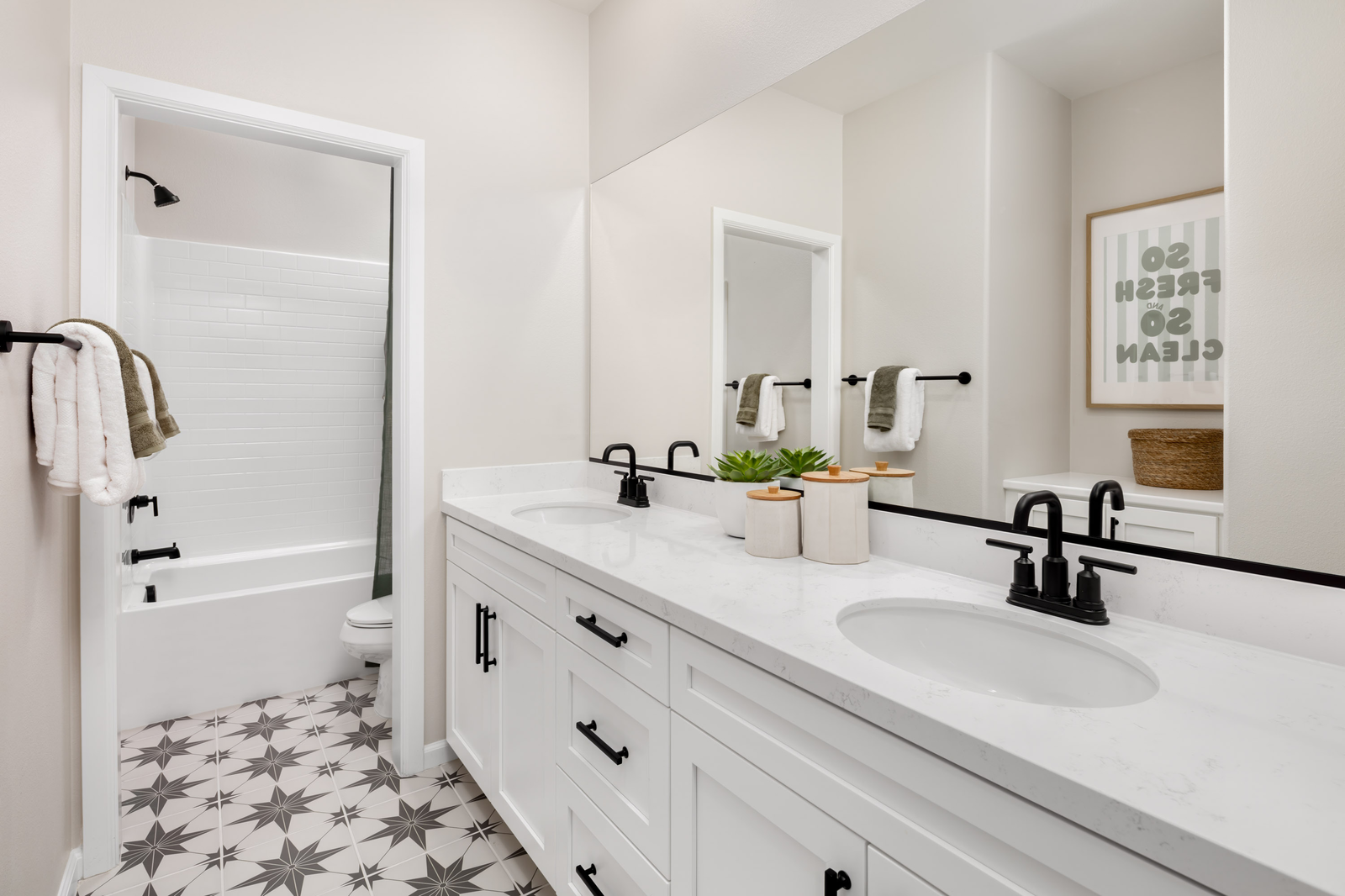 bathroom with tile flooring and white countertops