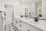bathroom with tile flooring and white countertops